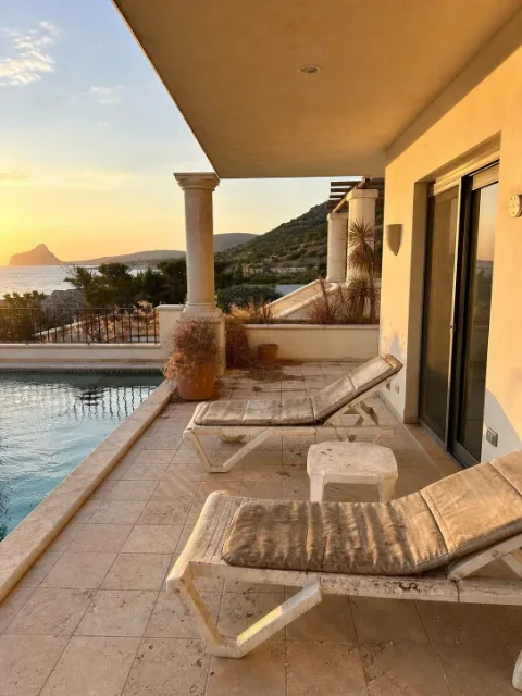 Empty pool terrace with outdoor seating area